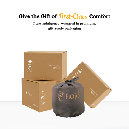 Memory foam travel neck pillow in a gray storage pouch with three brown gift-ready packaging boxes